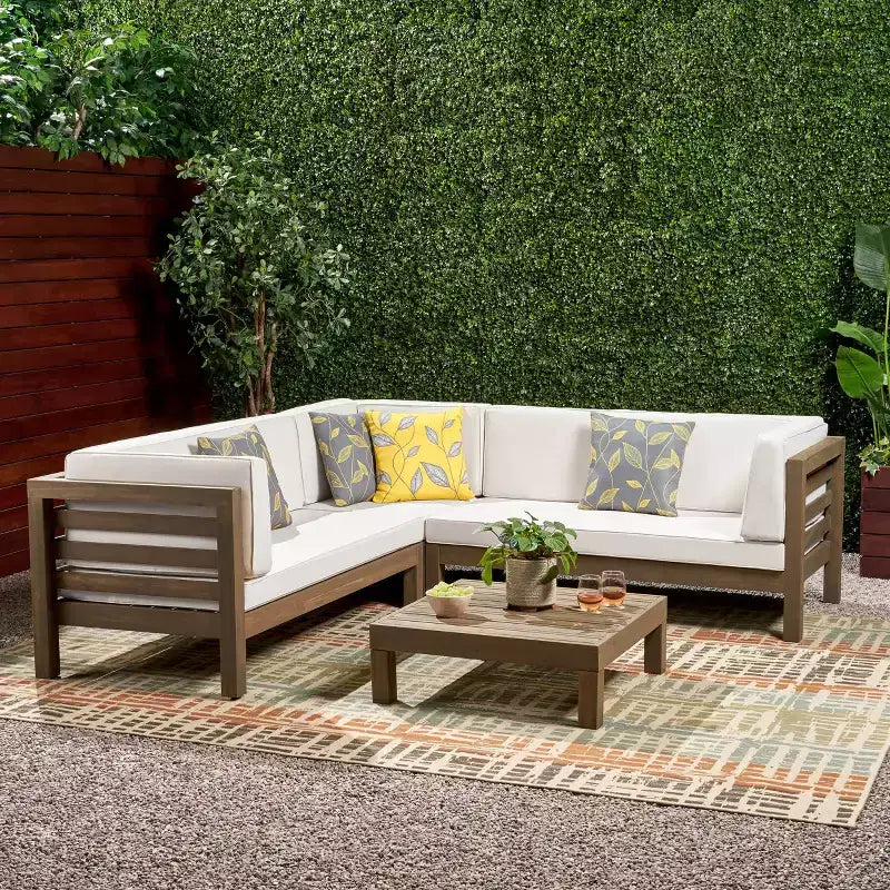 Christopher Knight Home Cynthia Ensemble de canapés de jardin modulables en L en bois d'acacia rembourrés à 5 places avec table basse